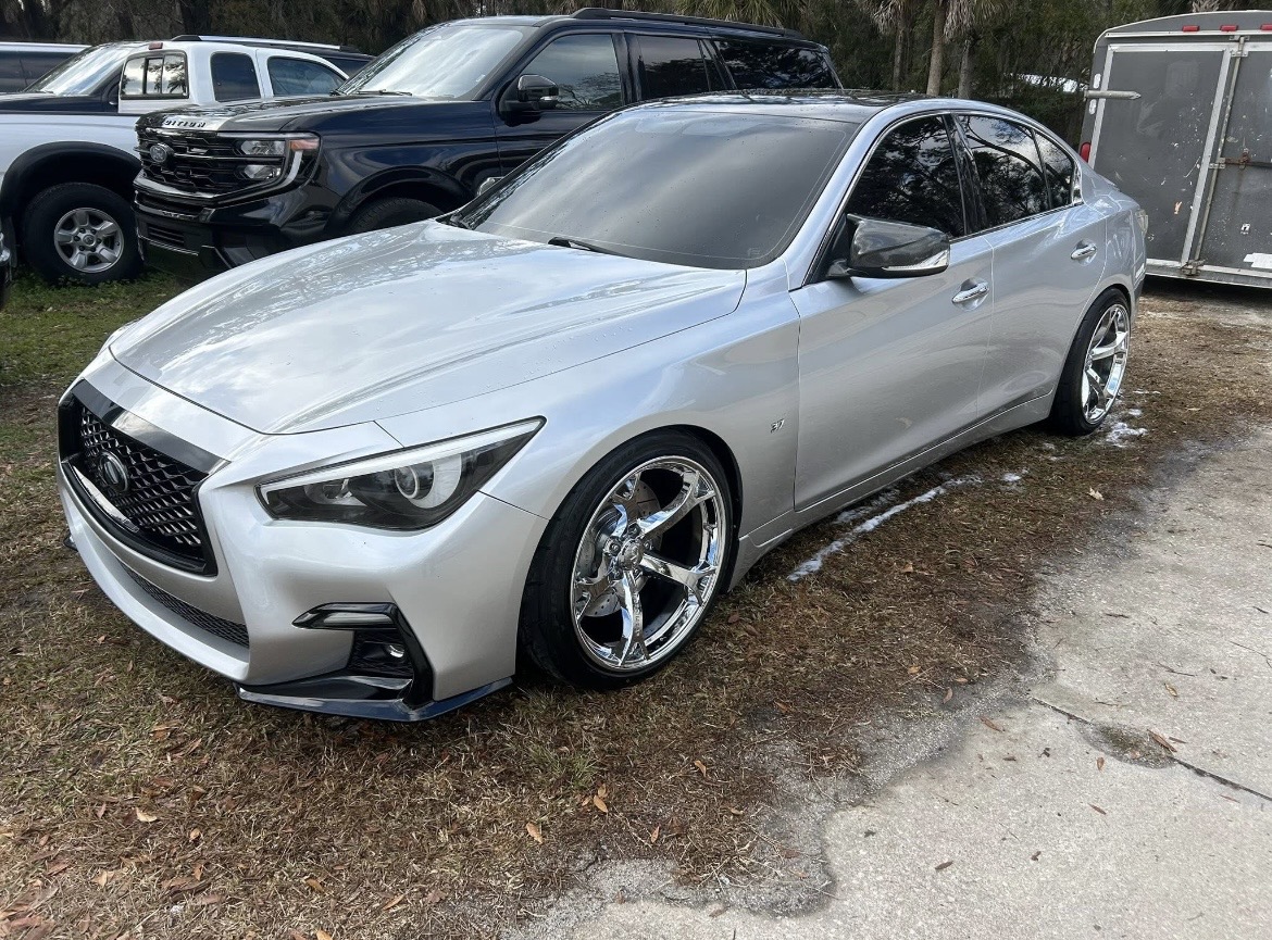 Silver Infiniti Q50 with a deep, reflective ceramic-coated finish